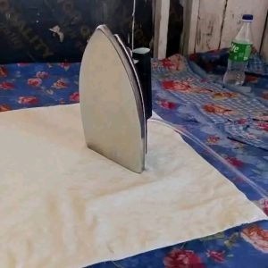 Nigerian Man Invents Pressing Iron That Uses LPG