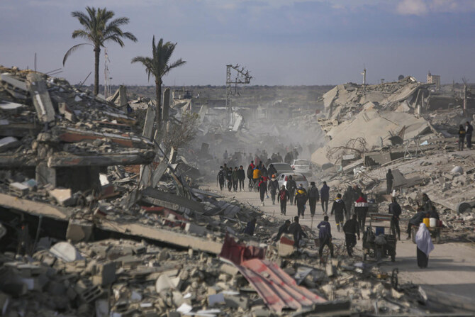 Palestinians Trek Across Rubble To Return To Their Homes As Gaza Ceasefire Takes Hold